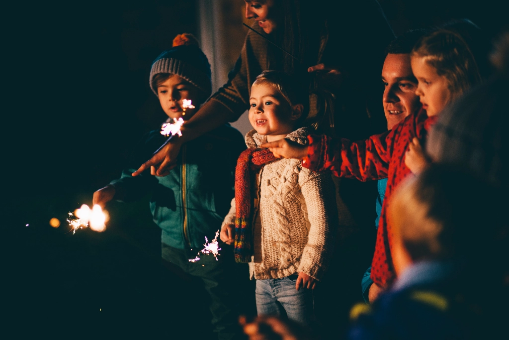 An image advertising bonfire night. Children have sparklers and are celebrating the fifth of November. The image is being used to advertise personal injury firm Gildeas Solicitors. They specialise in accident claims in Edinburgh and Glasgow, including road traffic accidents, motorcycle accidents, cycling accidents, and accidents at work. They are a no win no fee solicitors.