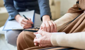 Solicitor meeting with personal injury client in a Scottish law office, offering legal advice and support for a compensation claim.