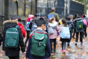 An image advertising personal injury firm Gildeas Solicitors office. They specialise in accident claims in Scotland, including road traffic accidents, motorcycle accidents, cycling accidents, and accidents at work. They are a no win no fee solicitors. The image shows young children walking to school in October.