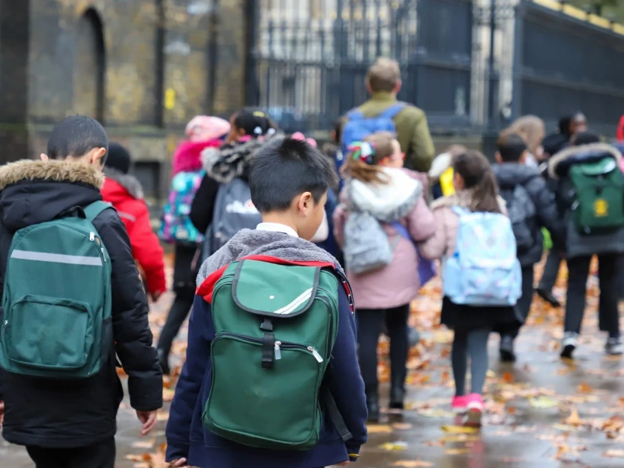 An image advertising personal injury firm Gildeas Solicitors office. They specialise in accident claims in Scotland, including road traffic accidents, motorcycle accidents, cycling accidents, and accidents at work. They are a no win no fee solicitors. The image shows young children walking to school in October.