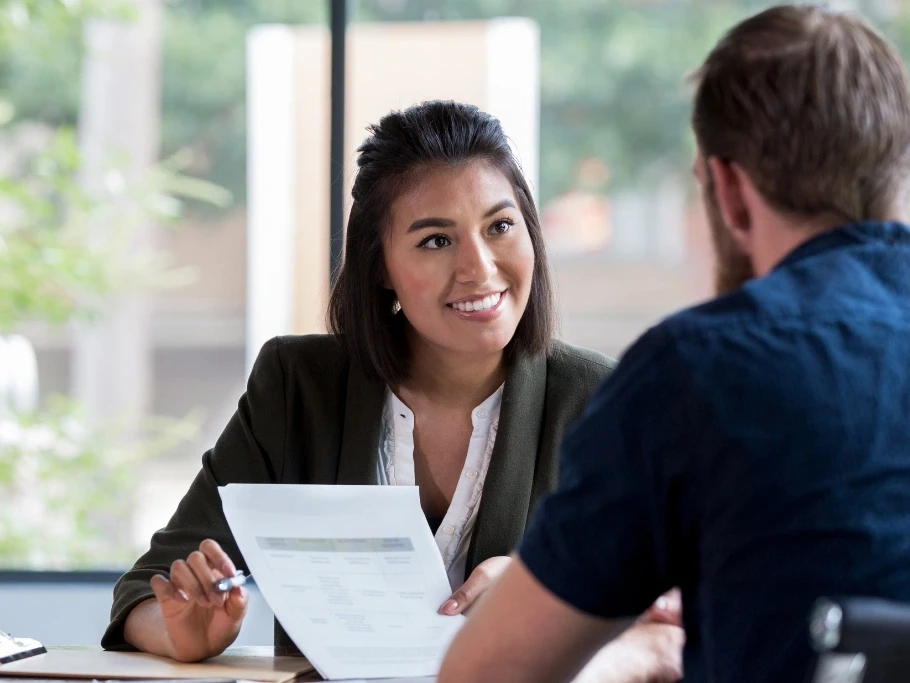 A friendly solicitor from Gildeas Solicitors in Edinburgh discusses a personal injury claim with a client, explaining mitigation strategies to support their case in Scotland.