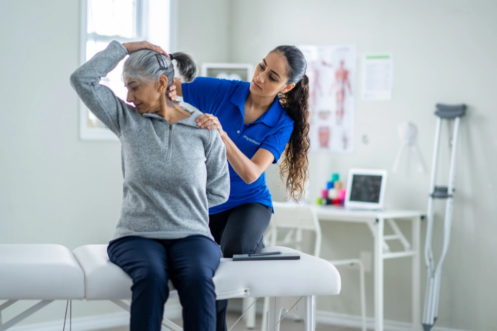 Physiotherapy rehabilitation session helping an older woman recover mobility after a personal injury, relevant to personal injury claims with Gildeas Solicitors.